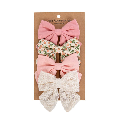Kidsely Meadow Bloom set featuring 3.5 inch pink solid, leafy floral, peach linen, and white daisy lace bows.