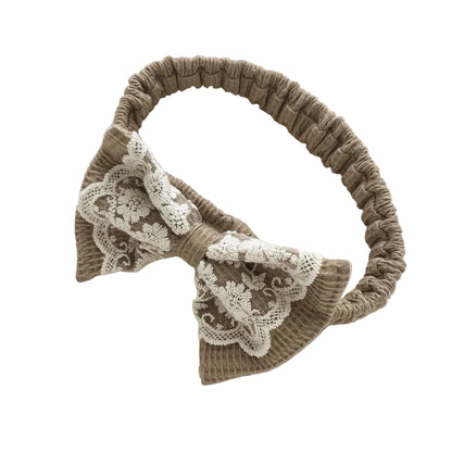 Stretchy mocha brown waffle knit baby girl headband featuring a vintage cream lace bow.