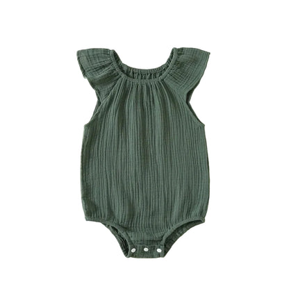Kidsely breathable cotton muslin flutter sleeve romper in deep juniper pine green.