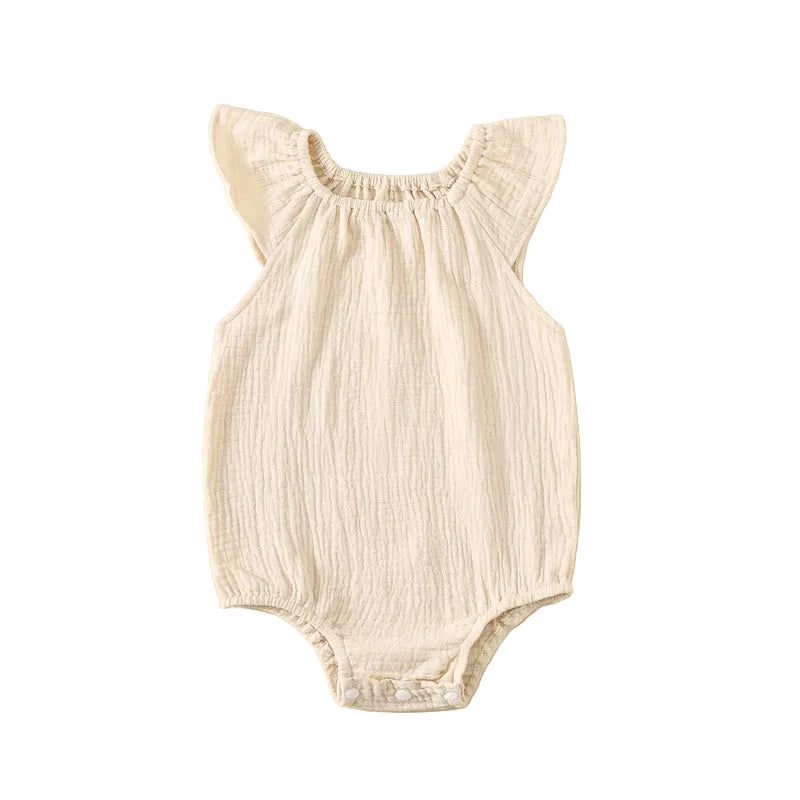 Kidsely 100% cotton textured muslin romper in creamy oatmeal milk beige.
