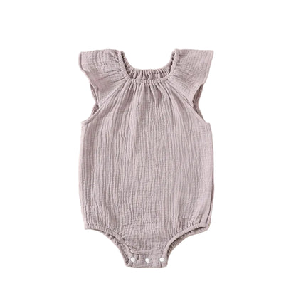 Kidsely boho-style muslin flutter sleeve romper in soft wild lavender purple.