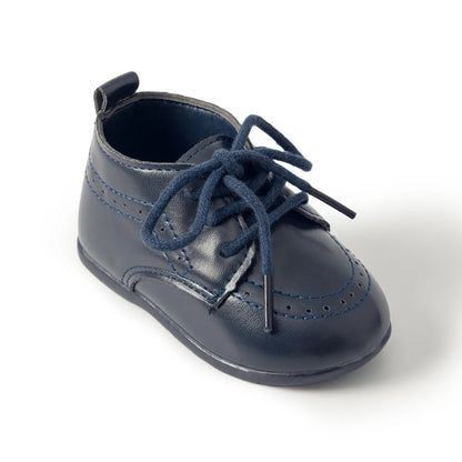 Single side-profile view of a Kidsely navy blue smooth faux leather toddler oxford shoe on a plain background.
