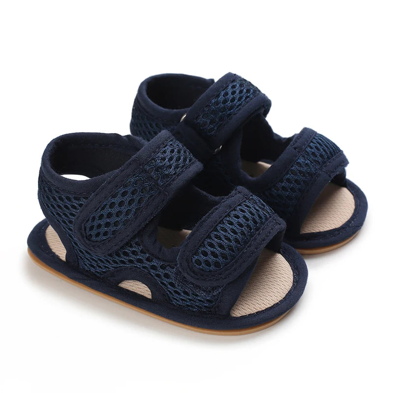 Navy blue first walker mesh sandals with a lightweight soft sole for infants learning to walk.