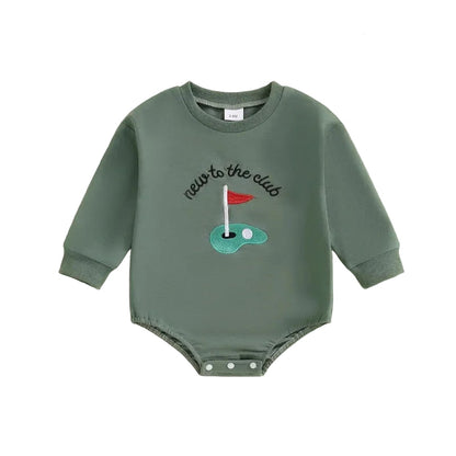 Front view of the Kidsely "New to the Club" long-sleeve baby golf romper in green, featuring an embroidered putting green and red flag.