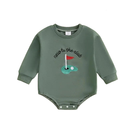Front view of the Kidsely "New to the Club" long-sleeve baby golf romper in green, featuring an embroidered putting green and red flag.