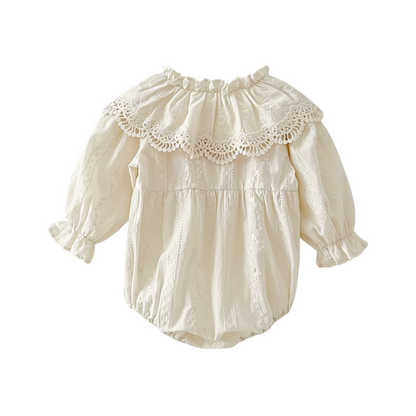 Back view of off-white infant lace bubble romper featuring gathered leg openings and oversized ruffled collar.