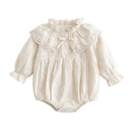 Off-white vintage baby girl bubble romper with a lace Peter Pan collar, bishop sleeves, and front bow detail.
