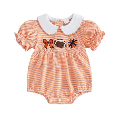 Front view of a baby girl's orange and white striped short-sleeve bubble romper featuring a white Peter Pan collar and football, cheer pom-pom, and bow embroidery on the chest.