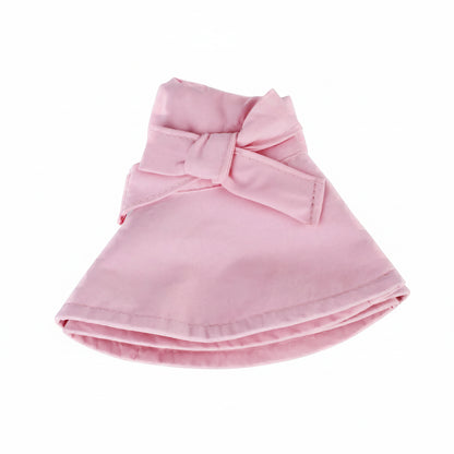 The pink wide brim cotton sun hat folded completely flat, demonstrating its packable, travel-friendly, and compact design for easy storage.