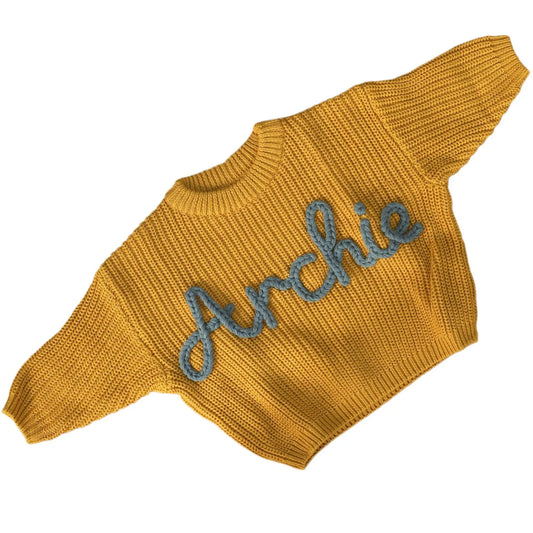 Personalized yellow chunky 100% cotton baby knit sweater hand-embroidered with the name Archie