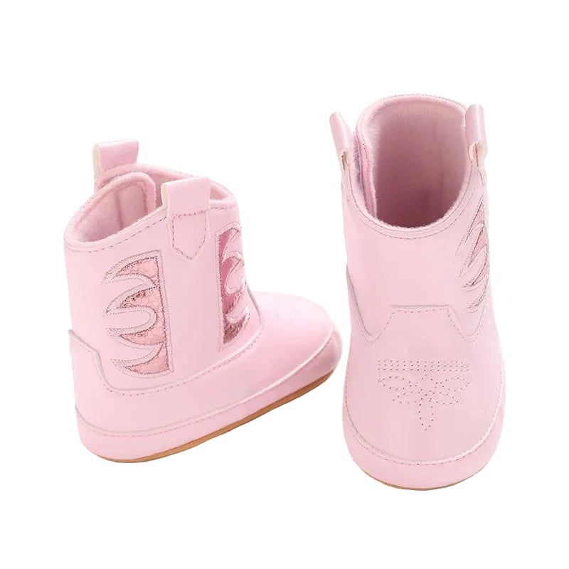 Back view of pink infant cowboy boots showing the wide top opening and secure side closure for easy dressing.