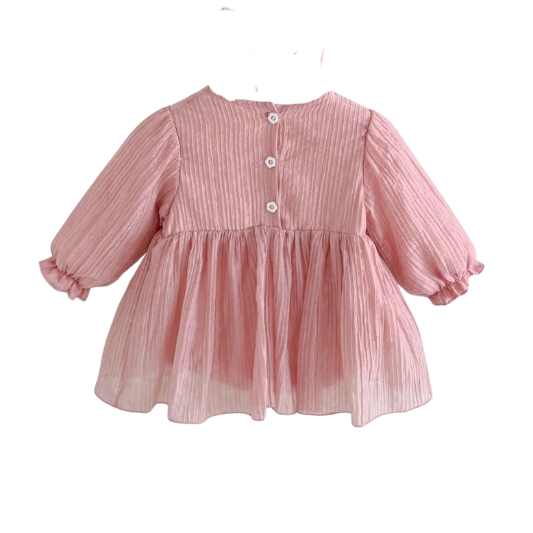 Back view of the dusty pink baby girl dress on a hanger showing the button closures at the back of the neck.