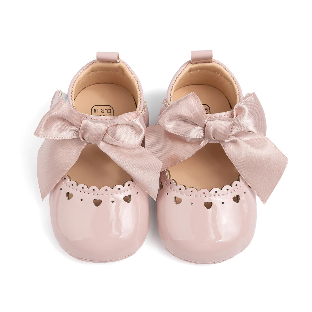 op-down view of pink infant Mary Jane shoes showing the inner lining and shoe structure.