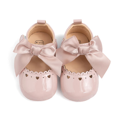 op-down view of pink infant Mary Jane shoes showing the inner lining and shoe structure.
