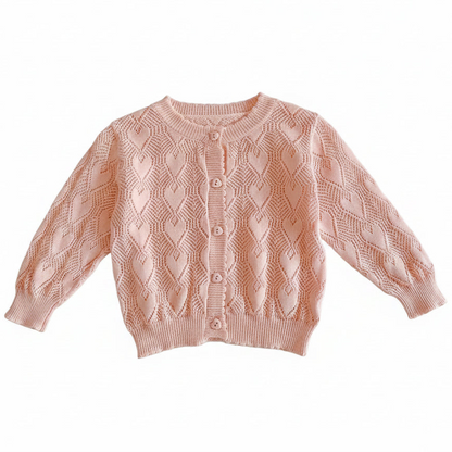 Full view of the pink baby girl cotton knit pointelle heart cardigan sweater laid flat against a white background.
