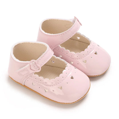 Light pink glossy vegan leather Mary Jane shoes for baby girls.