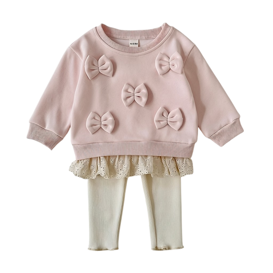Front view of the baby and toddler girl pink 3D bow sweatshirt and cream ribbed leggings 2-piece outfit set on a white background.