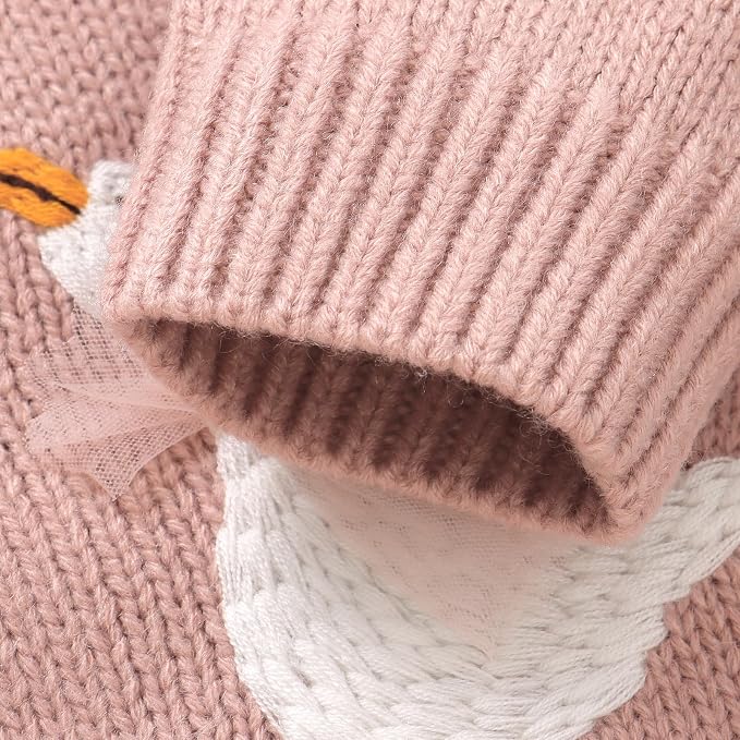 Close-up detail of the ribbed sleeve cuff and knit texture on the pink baby cardigan.