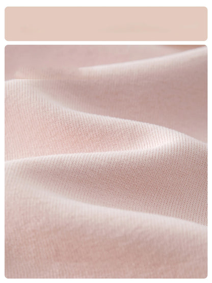Macro close-up showing the soft, breathable pink cotton blend fabric texture of the baby girl knit cardigan sweater.