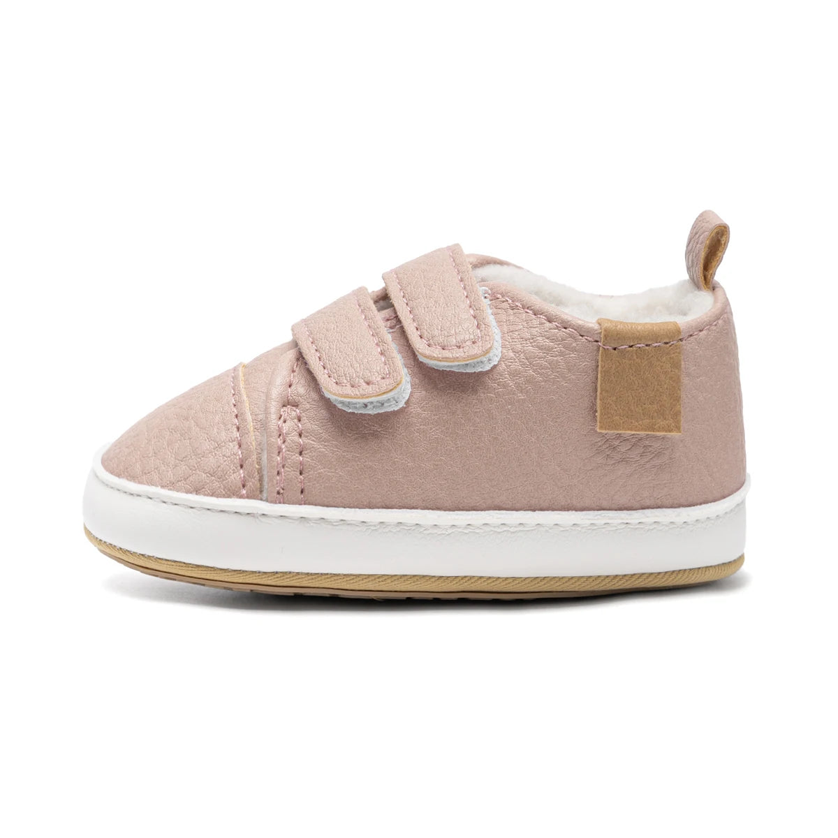 Side profile view of a single pink fleece-lined baby sneaker showing its soft, flexible construction and flat sole.