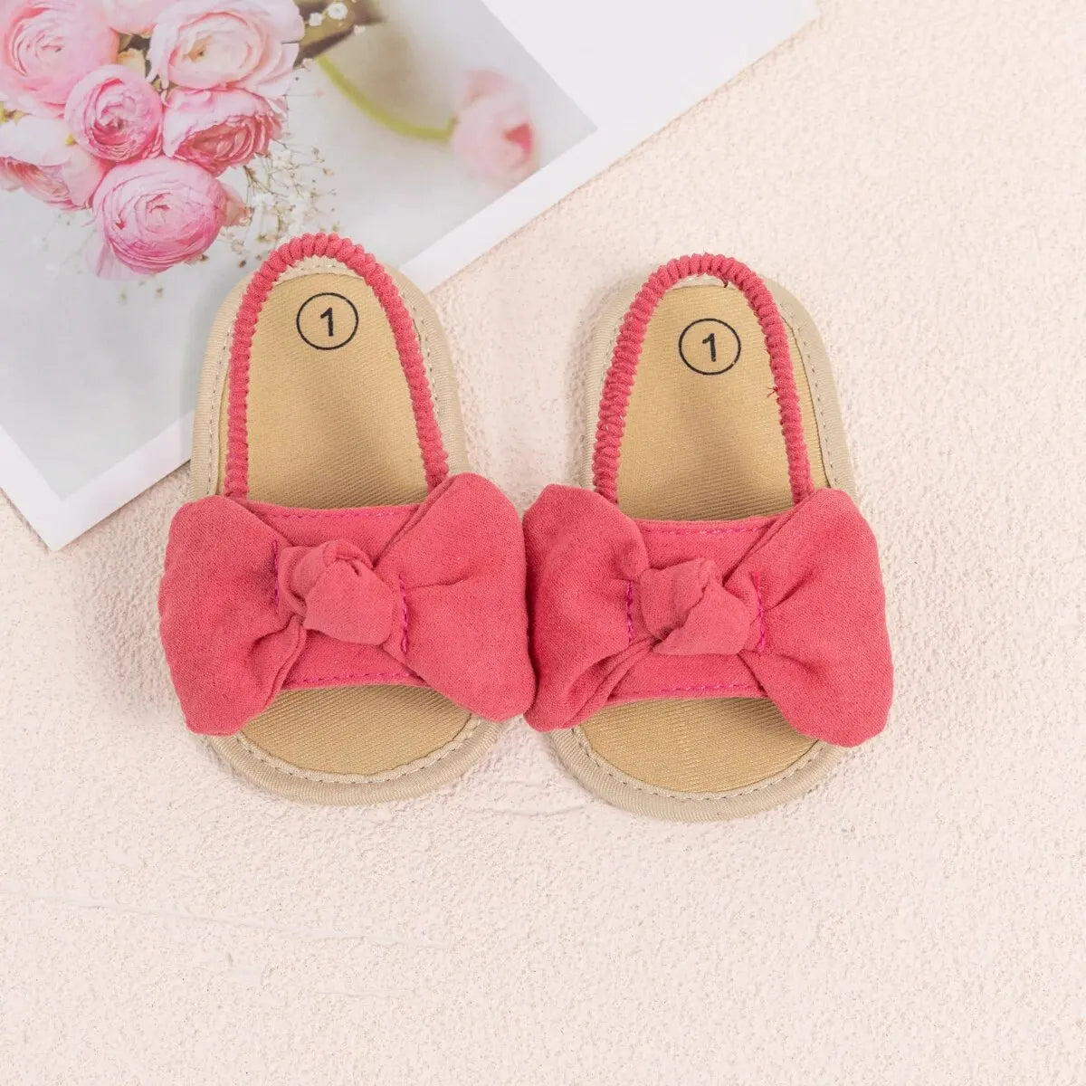 Top view of pink infant summer sandals showing the wide toe box and soft brushed fabric material.