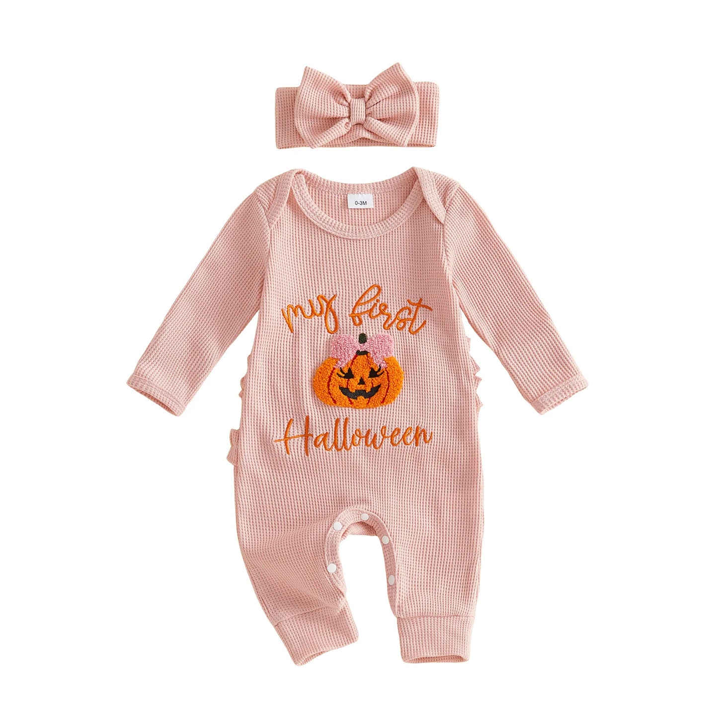 Pink ribbed long-sleeve baby romper featuring a "My first Halloween" pumpkin design, paired with a matching pink bow headband.