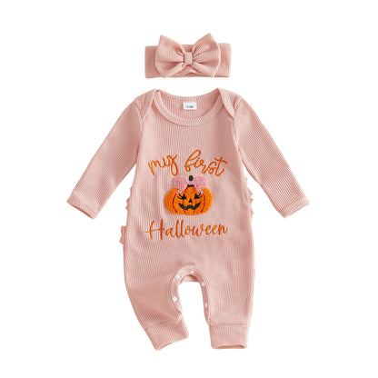 Pink ribbed long-sleeve baby romper featuring a "My first Halloween" pumpkin design, paired with a matching pink bow headband.