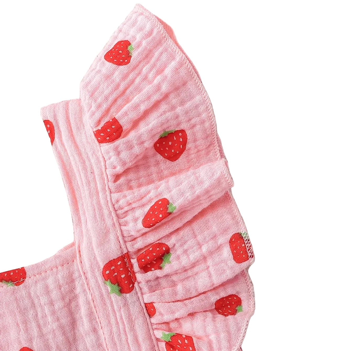 Close-up detail of the gathered flutter ruffle sleeve on the pink strawberry baby romper.