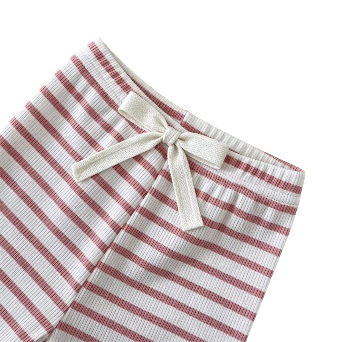 Close-up of the pink and white striped baby leggings featuring a decorative bow at the elastic waistband.