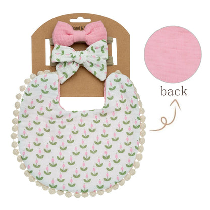 Vintgae style bib for baby girls with small pink tulip bud pattern on white muslin bib with blossom pink reversible backing.