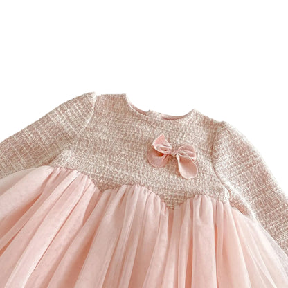 Close-up texture detail of the pink knit tweed bodice showing the subtle color variations and the coordinated 3D fabric bow appliqué on the chest.