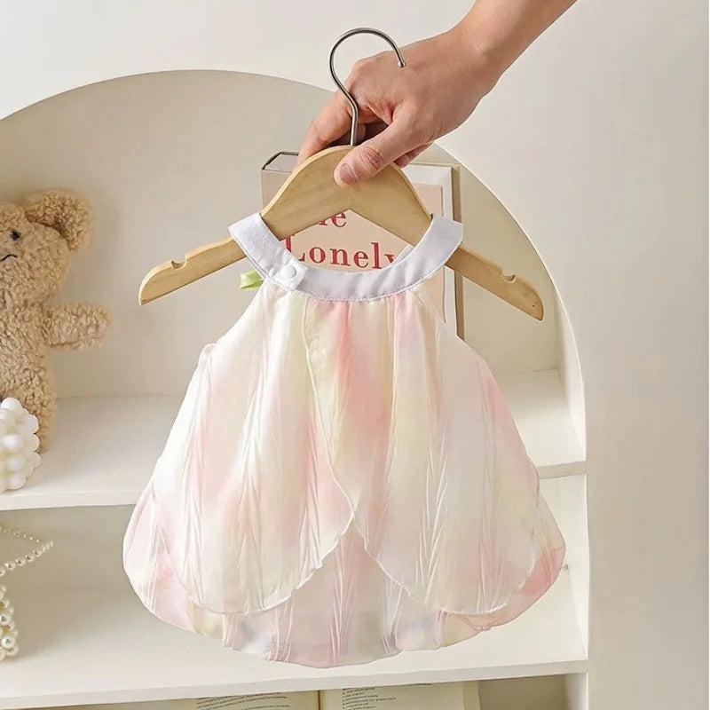 Back view of the pink and yellow tulip-petaled baby girl romper on a hanger.