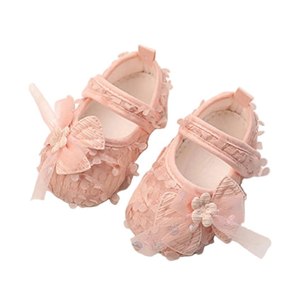 Pair of Kidsely petal pink baby girl princess first walker shoes with 3D floral petals and tulle bow.