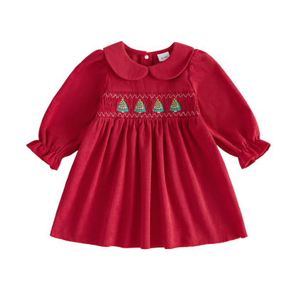 Red corduroy baby and toddler girl Christmas dress with long sleeves and smocked tree embroidery.