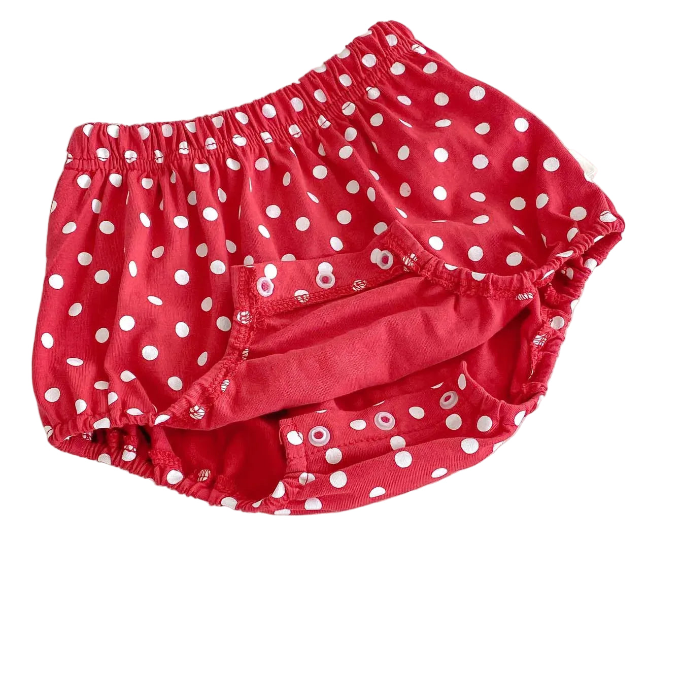 Red polka dot baby bloomers showing the inner lining and reinforced bottom snaps for easy diaper changes.