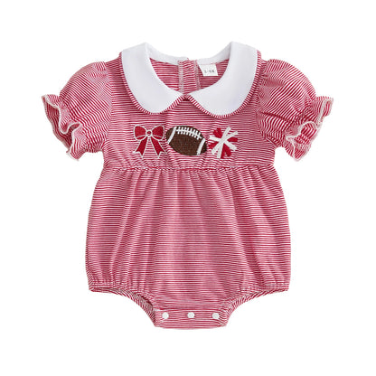 Flat lay of a baby girl's red and white striped short-sleeve bubble romper featuring a white Peter Pan collar and football, cheer pom-pom, and bow embroidery on the chest.