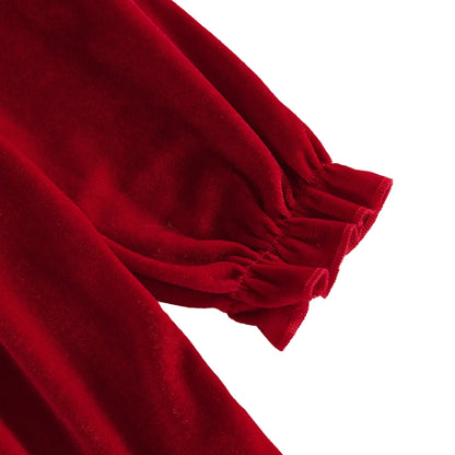 Close-up of the long sleeve elastic ruffled wrist cuff on the red velvet toddler Christmas dress