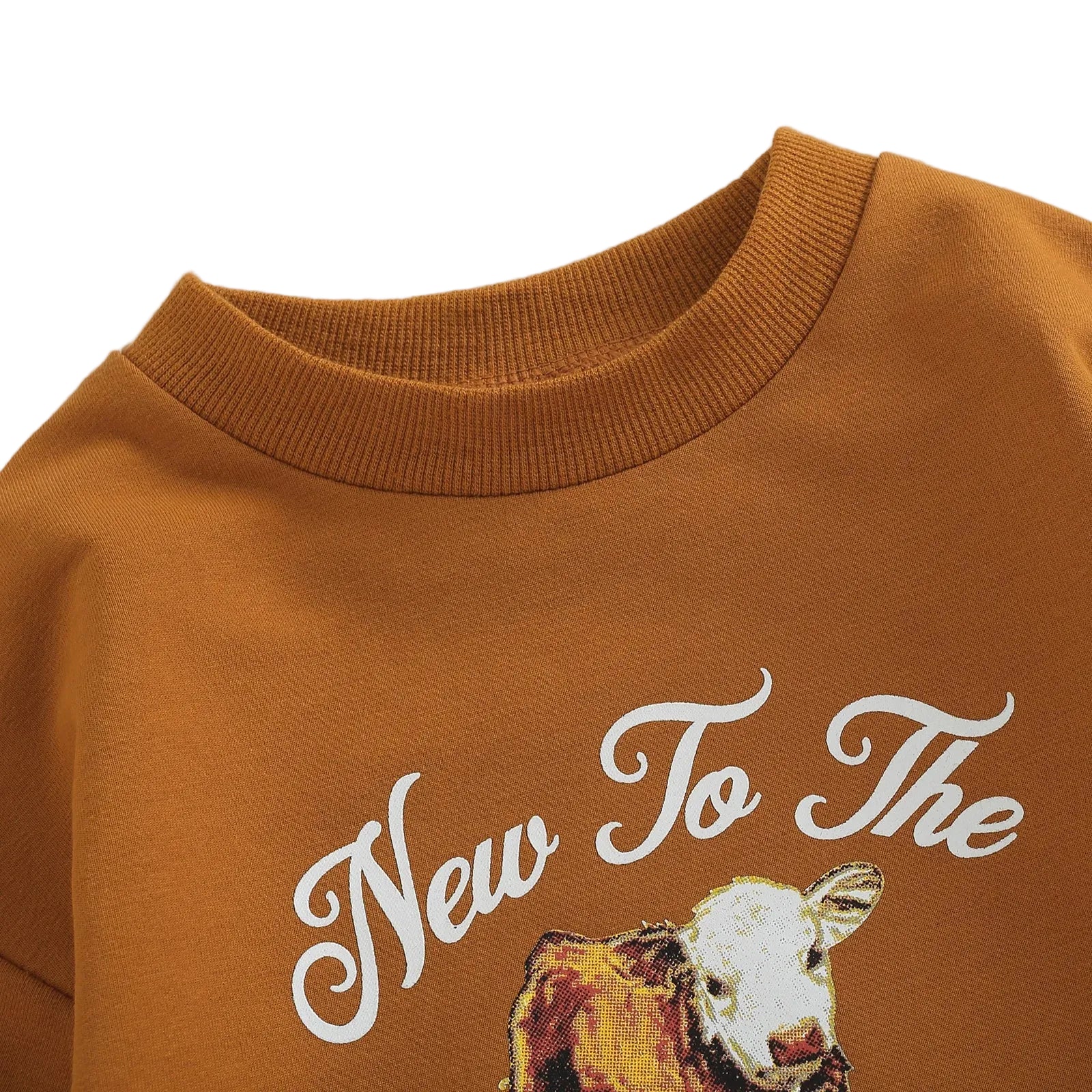 Close up of the crewneck collar and printed calf graphic on the rust New To The Herd baby sweatshirt romper.