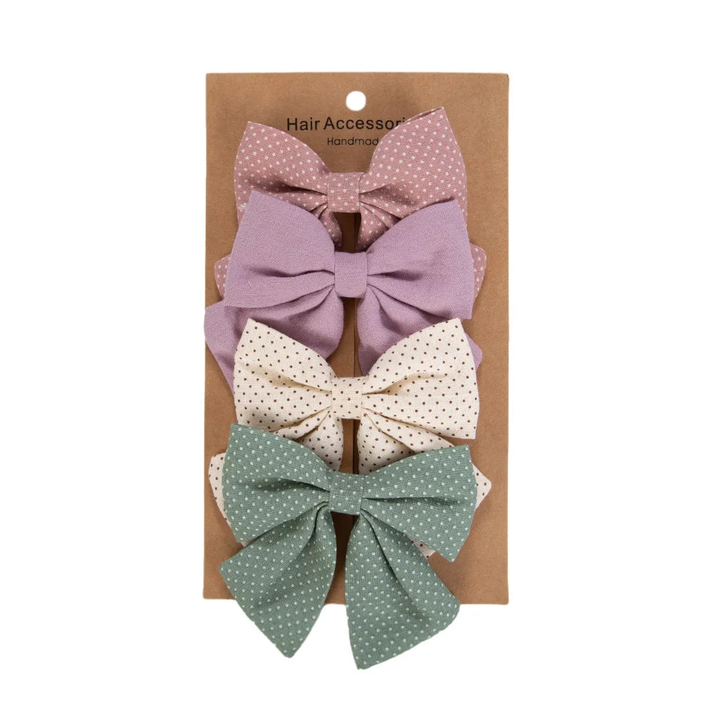 Kidsely Sage & Berry collection featuring 3.5 inch sage green, lavender, and mauve polka dot fabric hair clips.