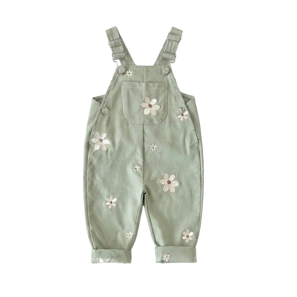 Sage green Kidsely toddler overalls featuring embroidered white daisies and a front chest pocket, displayed flat against a white background.