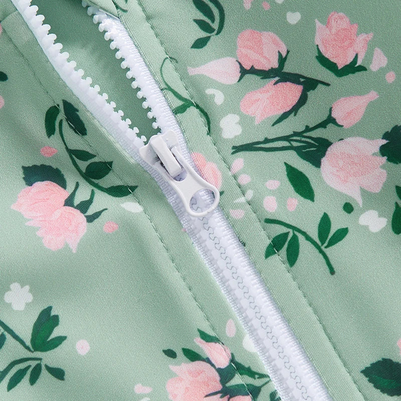 Close-up of the vintage rose floral print and non-pilling sage green fabric texture on the toddler long sleeve rash guard.