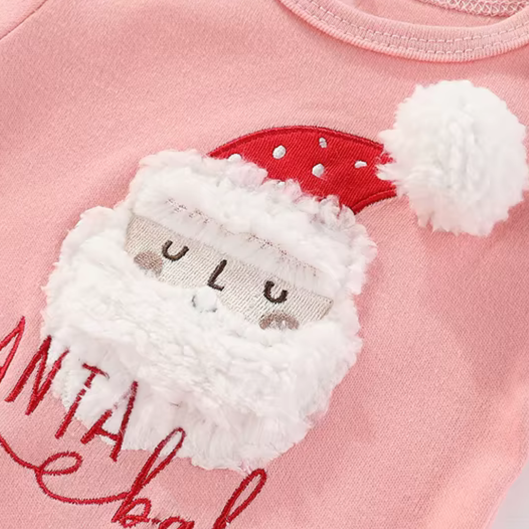 Close-up of pink baby bodysuit featuring plush Santa Claus face patch and Santa Baby embroidery