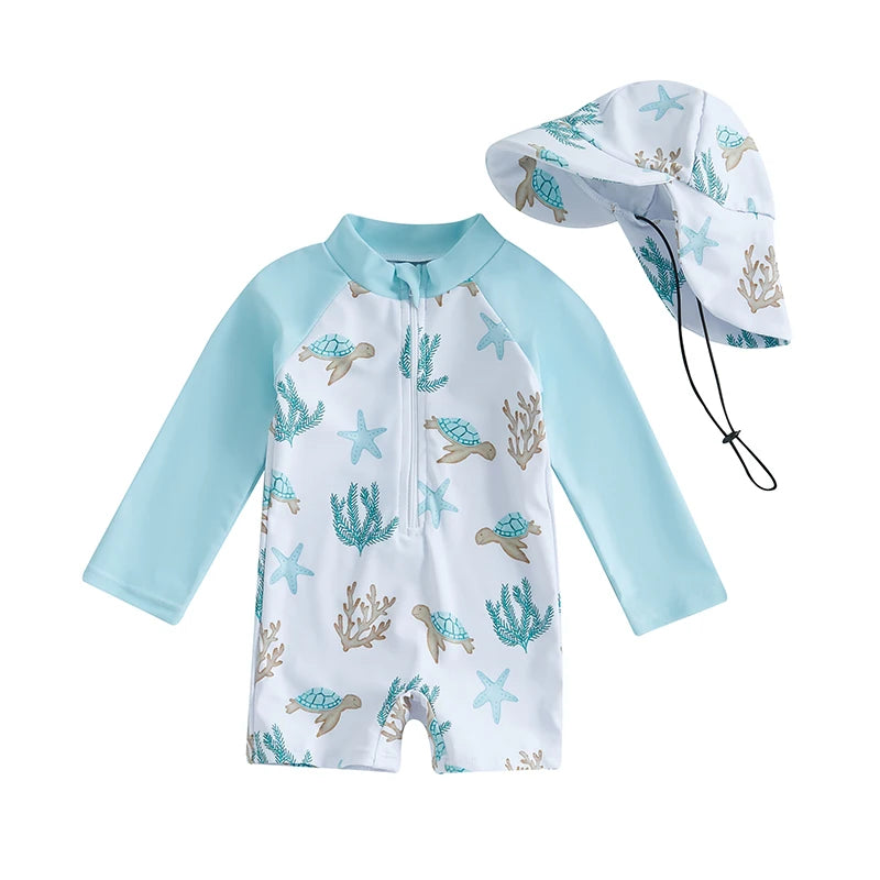 One-piece baby boy long sleeve rash guard swimsuit in white and aqua featuring a sea turtle and starfish print, paired with a matching wide-brim sun hat.