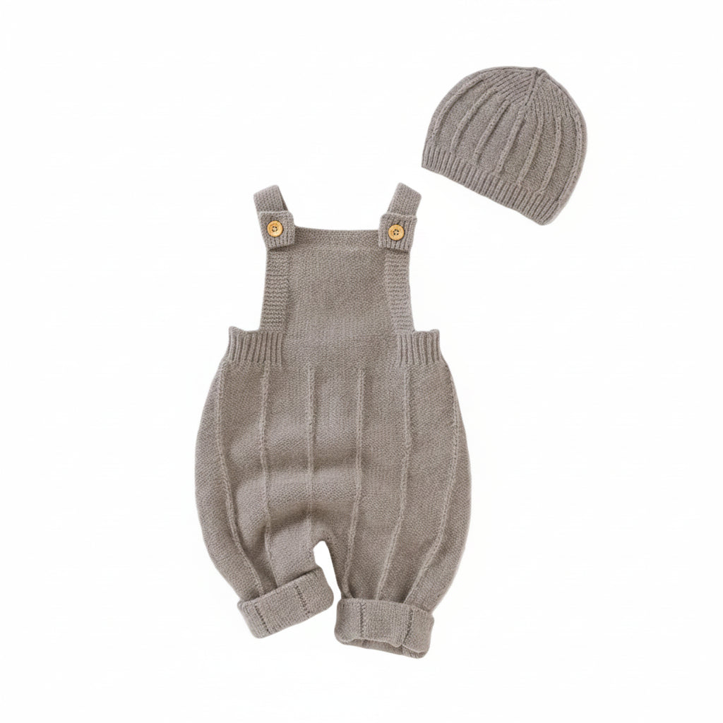 Beige seamless knit overalls and matching ribbed hat set displayed on a clean white background.