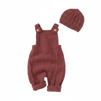 Burgundy seamless knit overalls and matching ribbed hat set displayed on a clean white background.