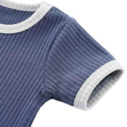 Kidsely durability detail: Close-up of the short sleeve cuff showing reinforced overlock stitching and soft contrast binding.