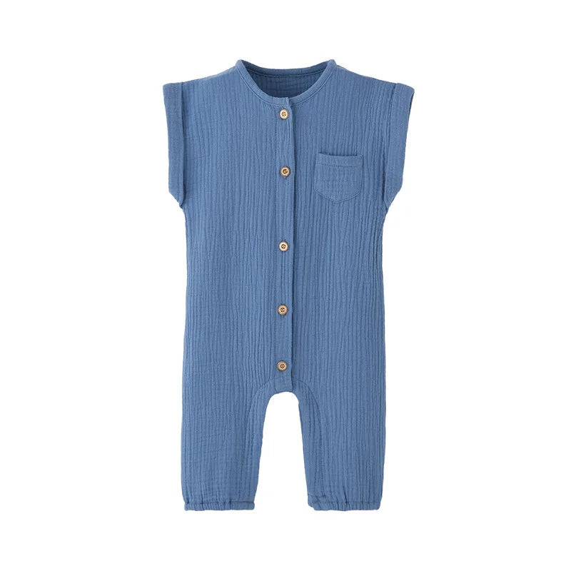 Front view of the vintage-inspired infant jumpsuit in a light slate blue, featuring a rolled cap sleeve and rustic buttons.