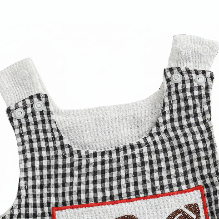 Angled view highlighting the high-quality cotton lining, secure shoulder snaps, and precise stitch detailing of the sleeveless infant game day bubble romper.