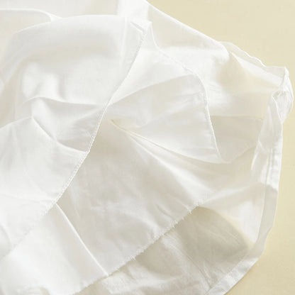 Close-up view showing the soft, non-scratchy 100% cotton inner lining underneath the white lace dress skirt.
