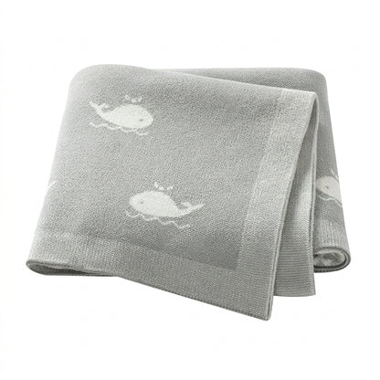 Kidsely soft knit baby blanket in gender neutral grey with white whale pattern